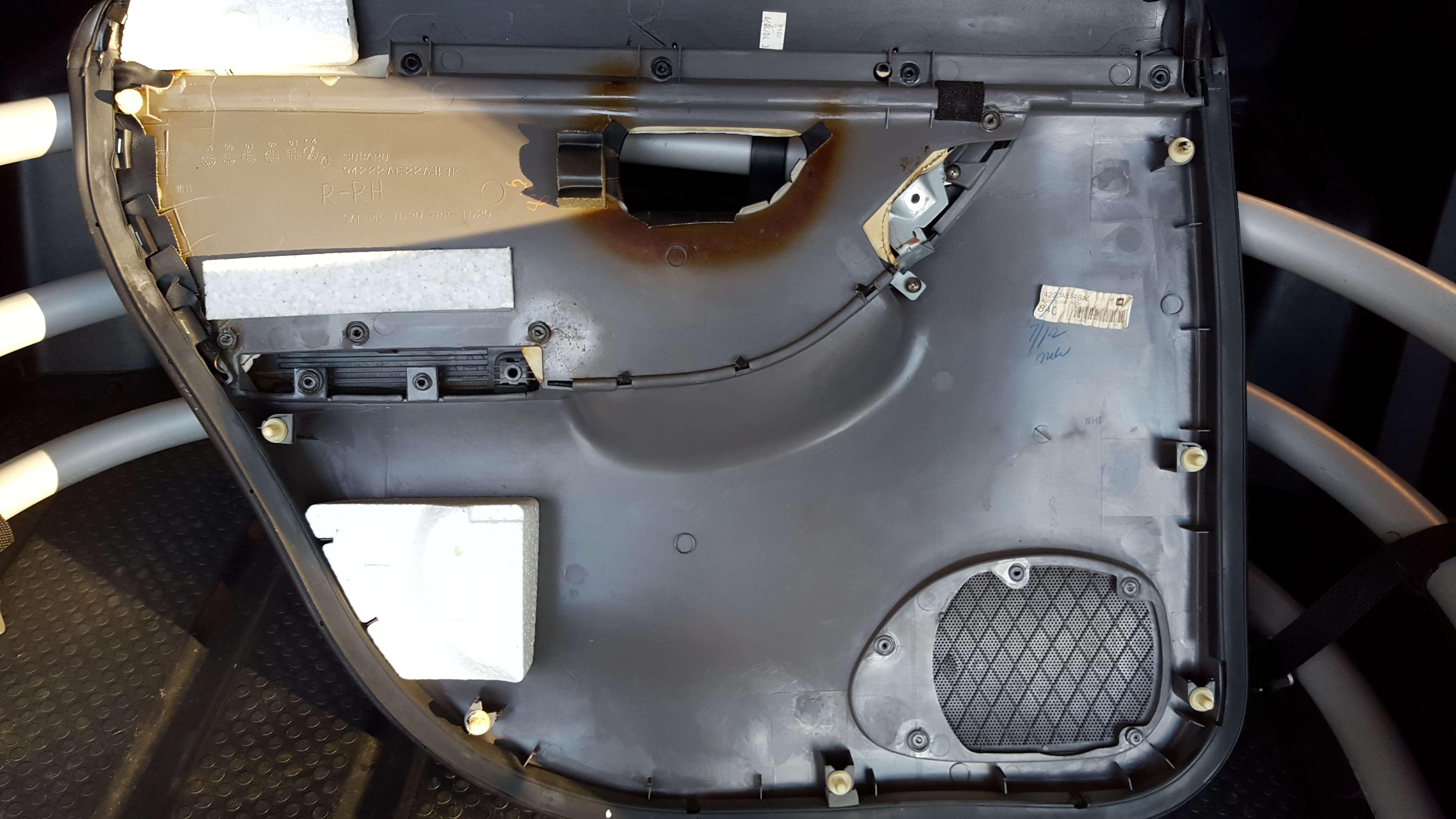 Back side where you can see the plastic pins that push/pull out of the door.
